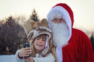 Child posing with Santa