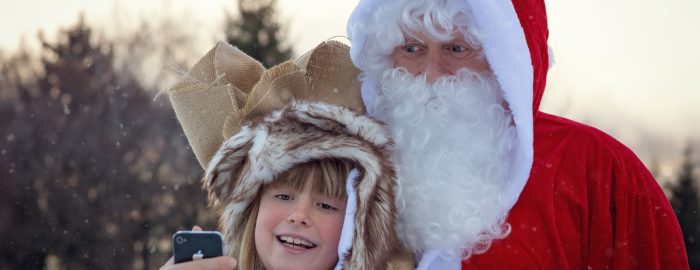 Child posing with Santa